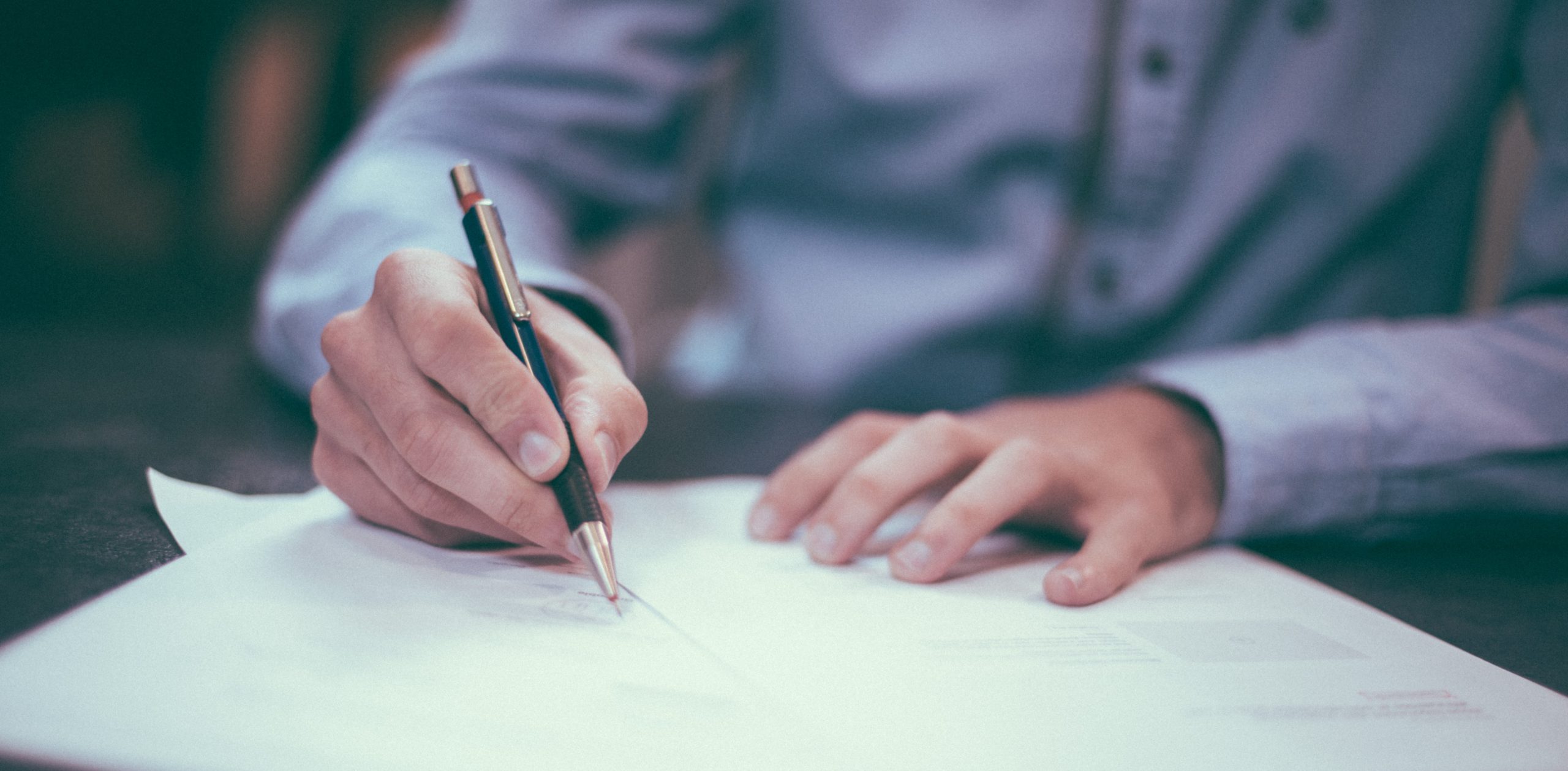 hands working on proofreading